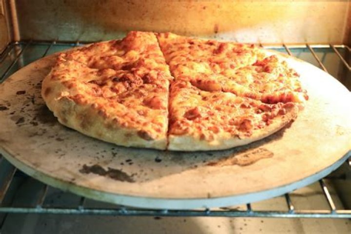 Can I cook a frozen pizza on a pizza stone?