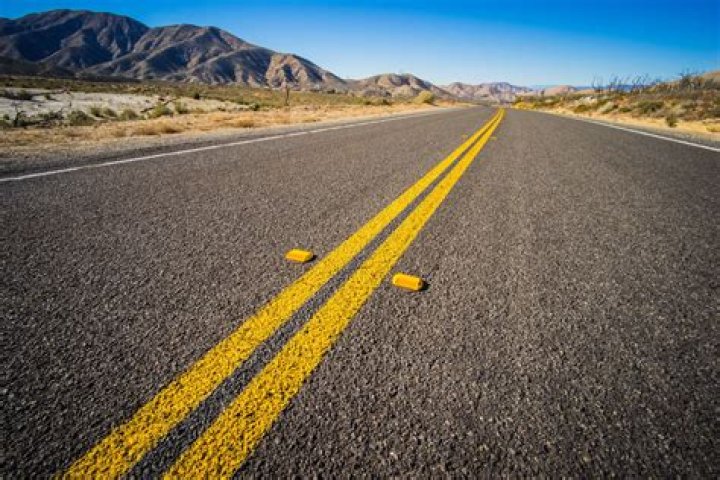 Can you ever cross a double yellow line in California?