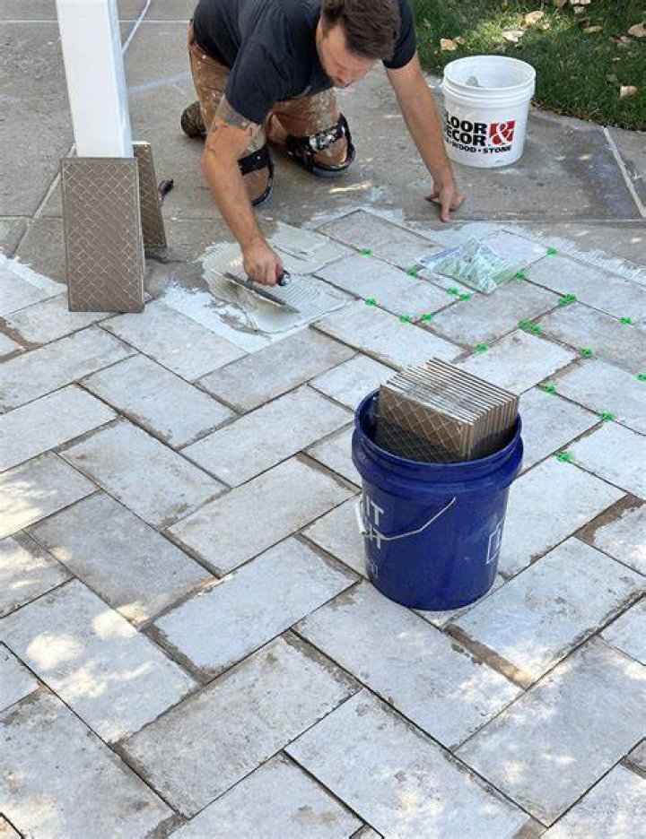 Can you tile over a concrete driveway?