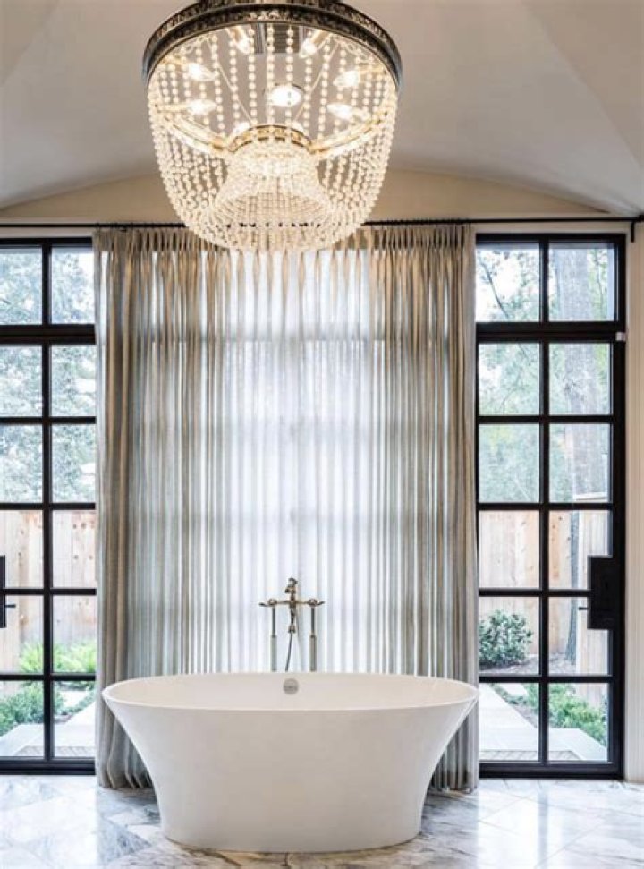 How big should a chandelier be over a bathtub?