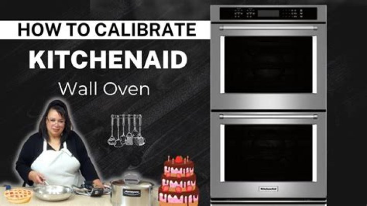 How do I calibrate my KitchenAid wall oven?