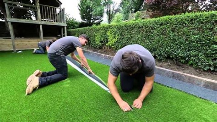 How do I lay artificial grass on my lawn?