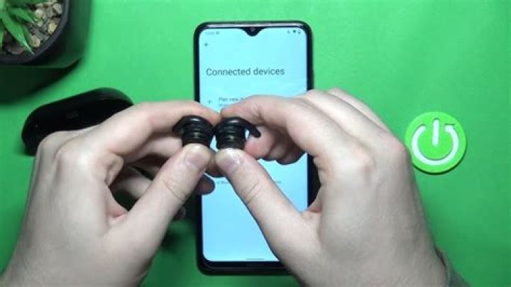 How do I pair my Jaybird earbuds to my iPhone?