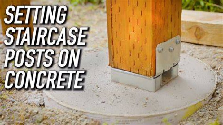 How do you attach a concrete post base?