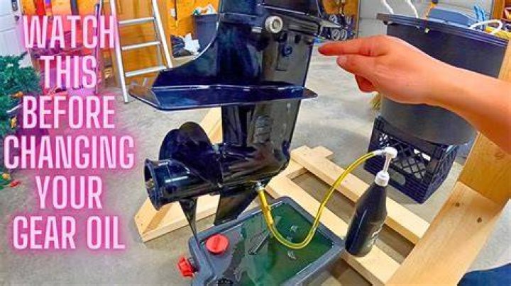 How do you change the oil on an outboard lower gear?