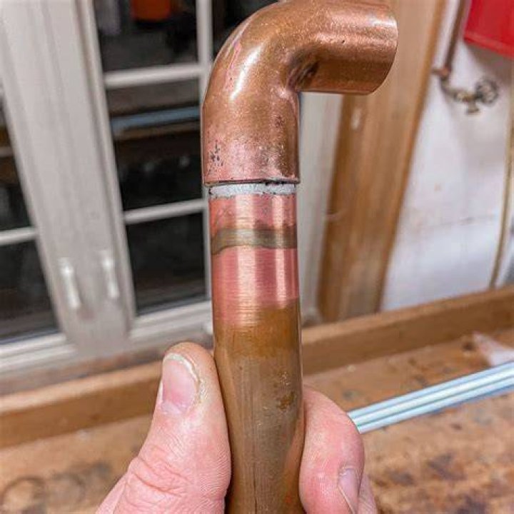 How do you clean burnt motorcycle pipes?