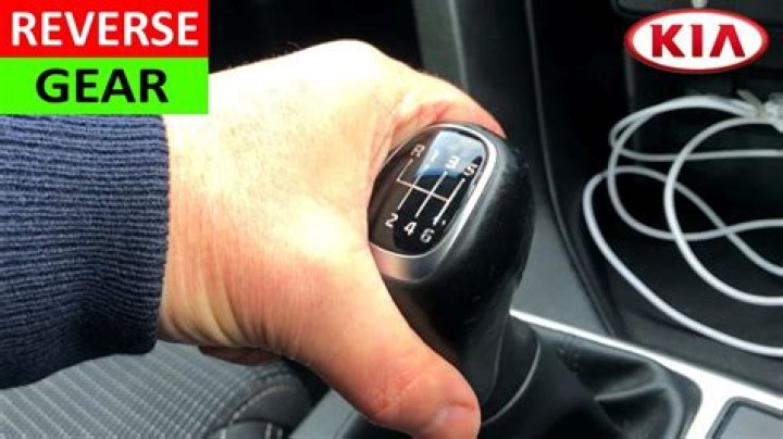 How do you engage reverse gear?