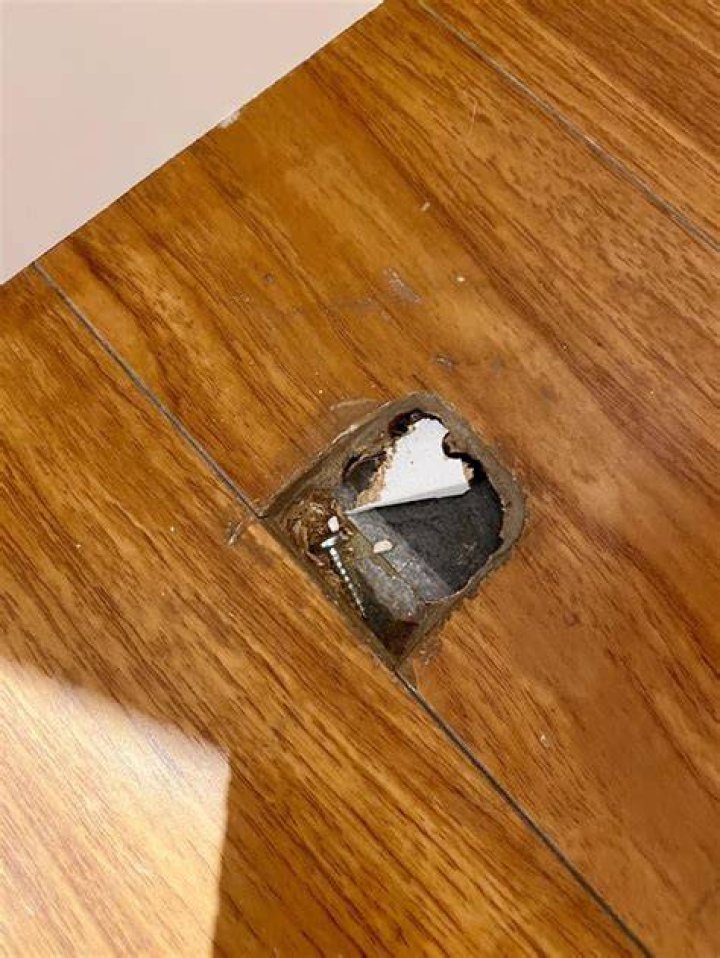 How do you fill holes in floorboards?