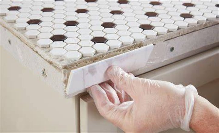 How do you finish the edge of a mosaic table?