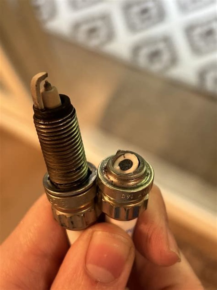 How do you get a broken spark plug out of a cylinder?