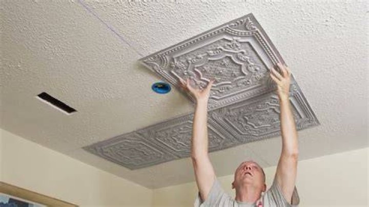 How do you install ceiling tiles on a popcorn ceiling?