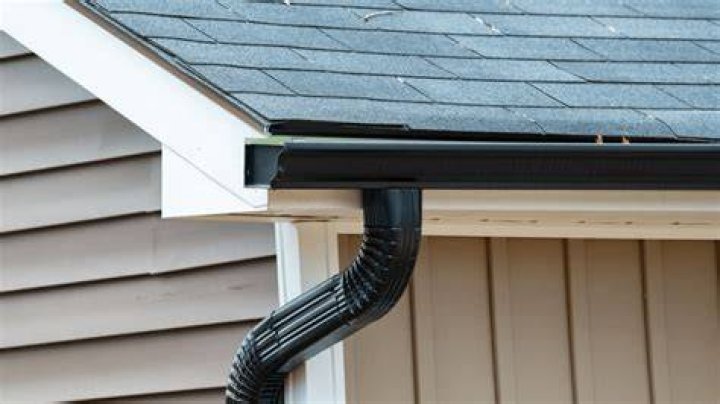 How do you install vinyl gutter downspouts?