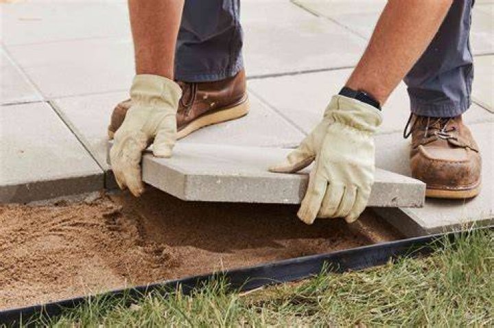 How do you lay a concrete patio with pavers?