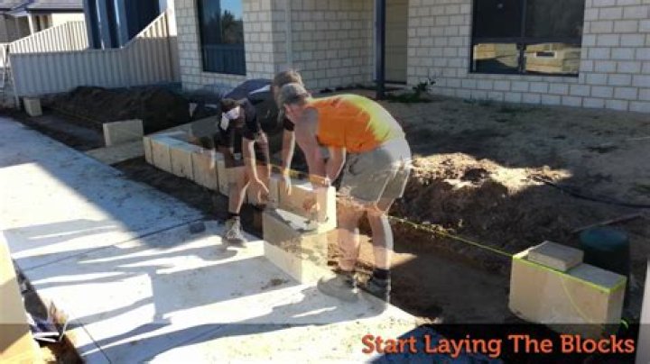 How do you lay limestone block walls?