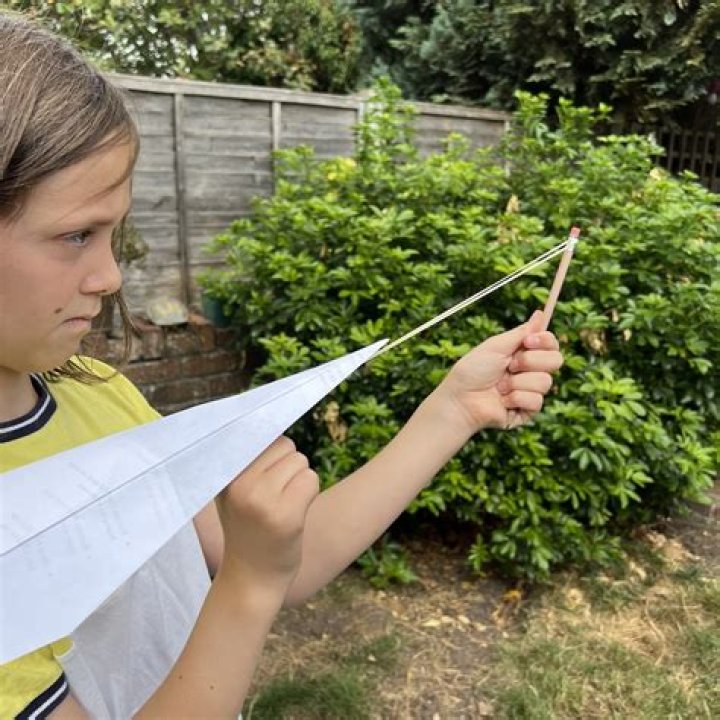 How do you make a paper airplane catapult?