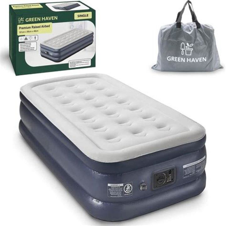 How do you make an air mattress look like a real bed?