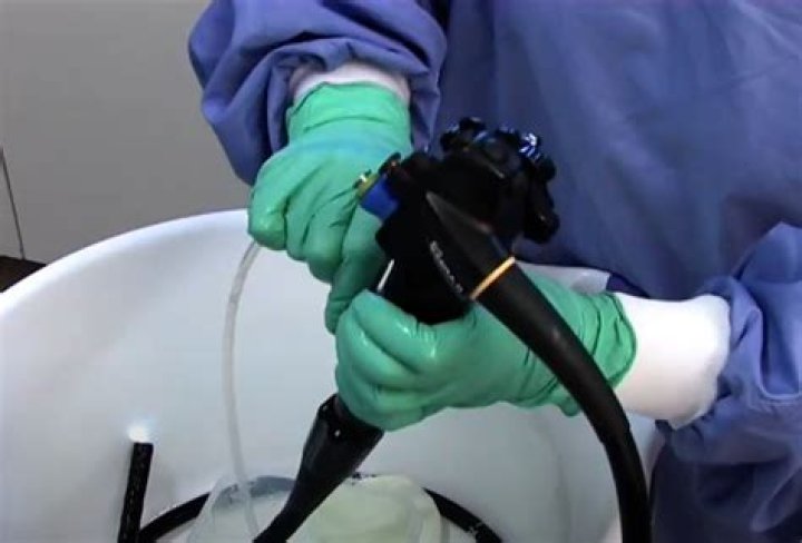 How do you manually clean an endoscope?