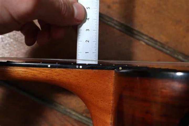 How do you measure action at 12th fret?