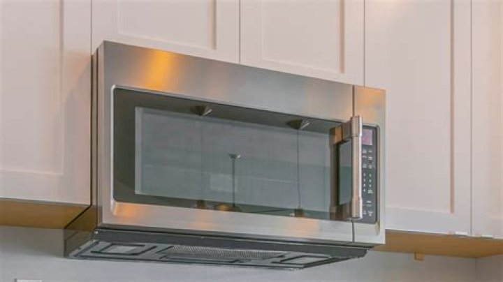 How do you mount a microwave on the wall?