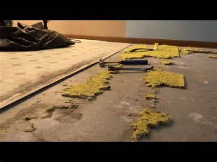 How do you remove old carpet padding stuck to hardwood floors?