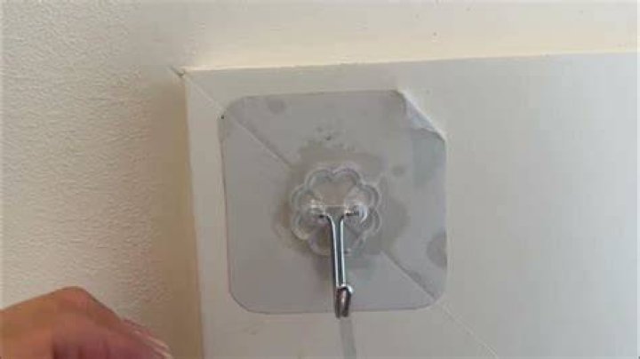 How do you remove sticky hooks?