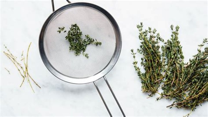 How do you remove thyme leaves from stems?