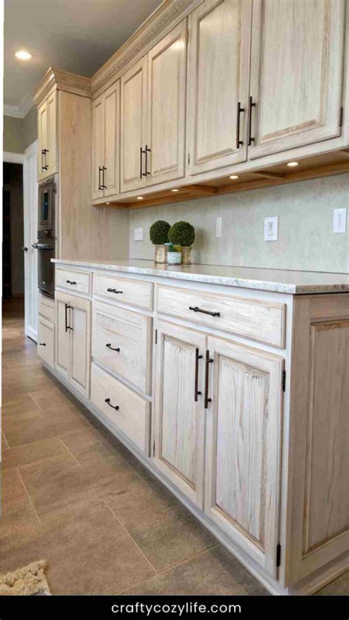 How do you whitewash kitchen cabinets?