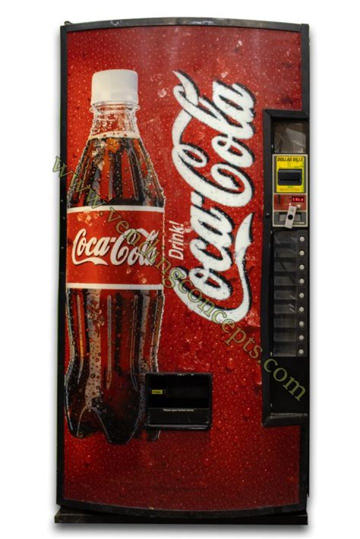 How heavy is a Coke vending machine?