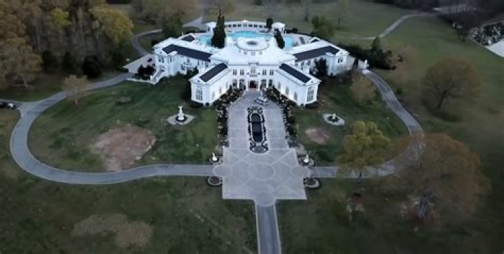 How much did Rick Ross pay for Holyfield house?