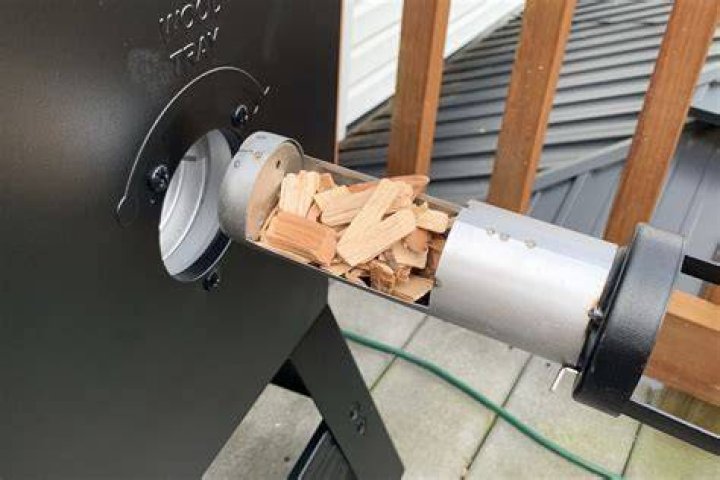How often do I add wood chips to my smoker?