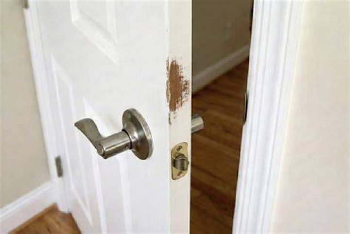 What causes a door to stick?