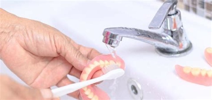 What do you clean dentures with?
