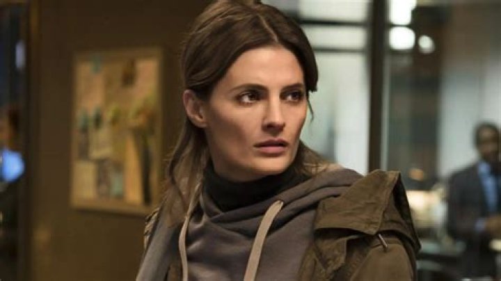 What does booked in absentia mean?