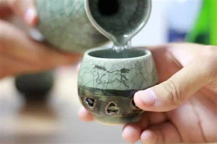 What is the proper way to drink sake?
