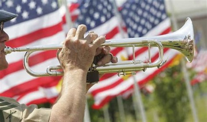 What time is Taps played on military bases?