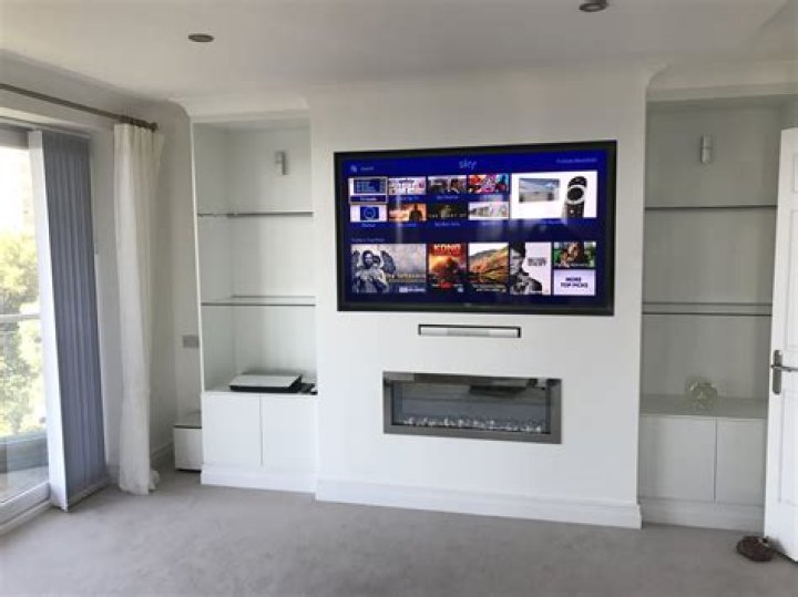 Where do you hide sky box when wall mounting TV?