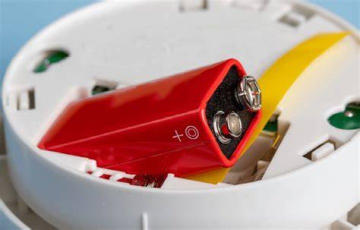 Why does smoke detector beep after replacing battery?